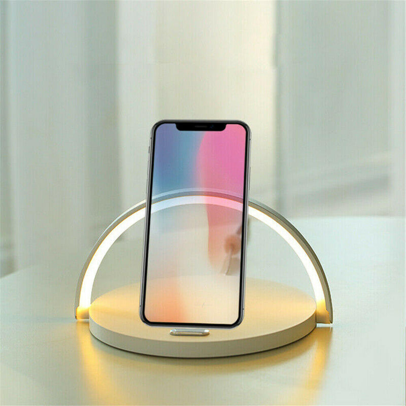 Multifunctional LED lighting phone stand providing illumination and wireless charging for smartphones