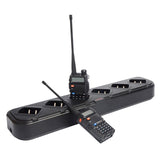 Zastone 6 way UV-5R rapid charger with two black walkie talkies placed on and near the charger