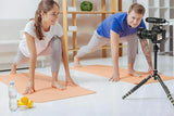 BOYA BM2021 shotgun microphone mounted on a camera capturing a yoga session in a bright studio