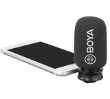 BOYA BY-DM200 microphone for iPhone with foam windscreen mounted next to a white smartphone
