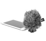 BOYA BY-DM200 microphone for iPhone with furry windscreen attached next to a smartphone