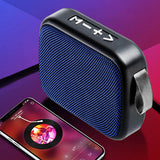 Compact cloth covered Bluetooth speaker with control buttons, paired with a smartphone for audio playback