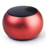 Stylish red mini Bluetooth speaker UK with a compact design and LED light for portable audio enjoyment