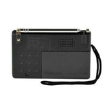 Indin portable AM FM radio with a sleek design and an attached wrist strap for easy carrying