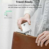 Unbranded compact 4 port USB wall charger UK being placed in a brown leather bag for travel