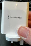 Unbranded 5 port USB charger 48watt QC3.0 white compact fast charging adapter held in hand