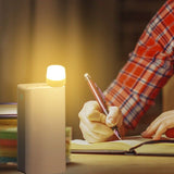 USB LED mini night light illuminating a workspace, perfect for reading or writing at night