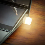 USB LED mini night light plugged into a laptop for added convenience and soft illumination