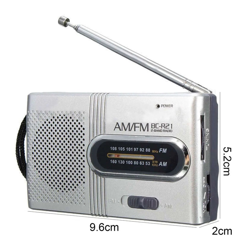 Compact portable pocket AM FM radio with telescopic antenna and manual tuning dial