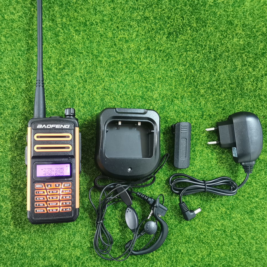 Baofeng TR-988UV triband radio with charger, earpiece, and power adapter for reliable communication