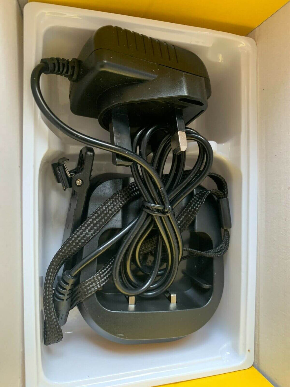 Charger and accessories for Baofeng UV-10R Plus two way radio in packaging