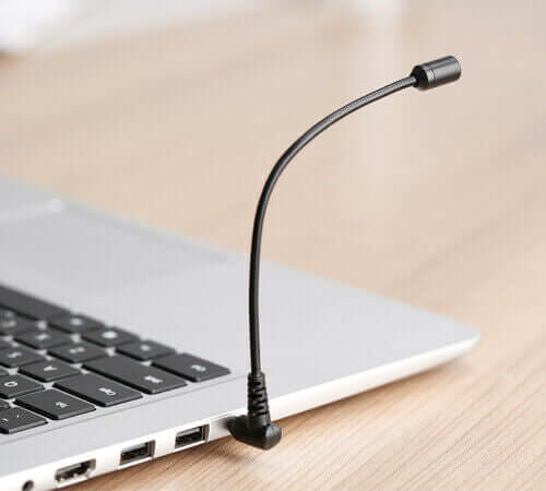 BOYA BY-UM4 flexible microphone connected to a laptop, ideal for clear audio recording