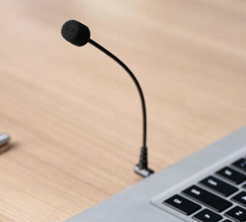 BOYA BY-UM4 flexible microphone positioned near a laptop for clear audio capture