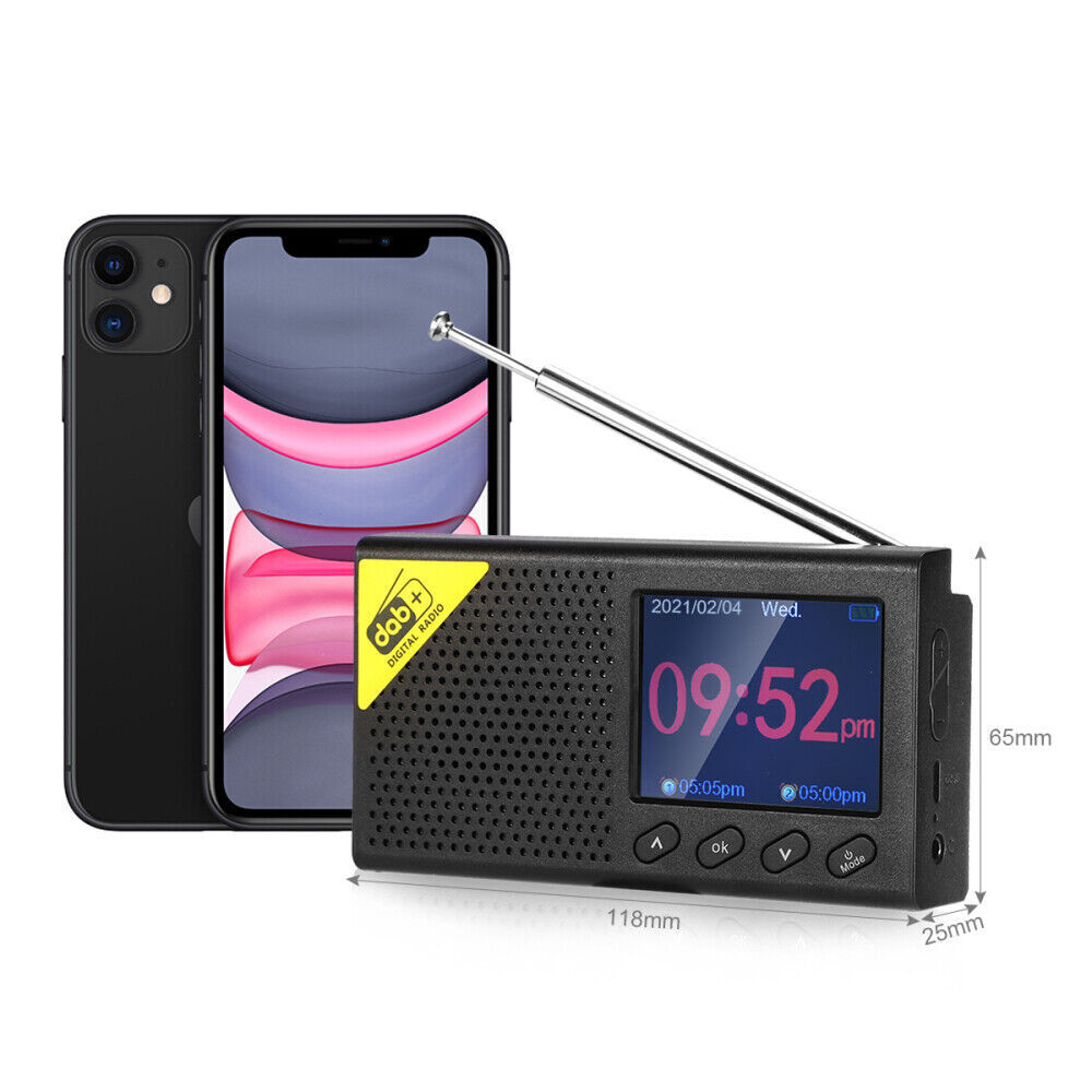 Compact DAB digital radio portable with digital display and telescopic antenna beside smartphone