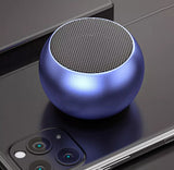 Compact and stylish mini Bluetooth speaker UK on a sleek smartphone surface