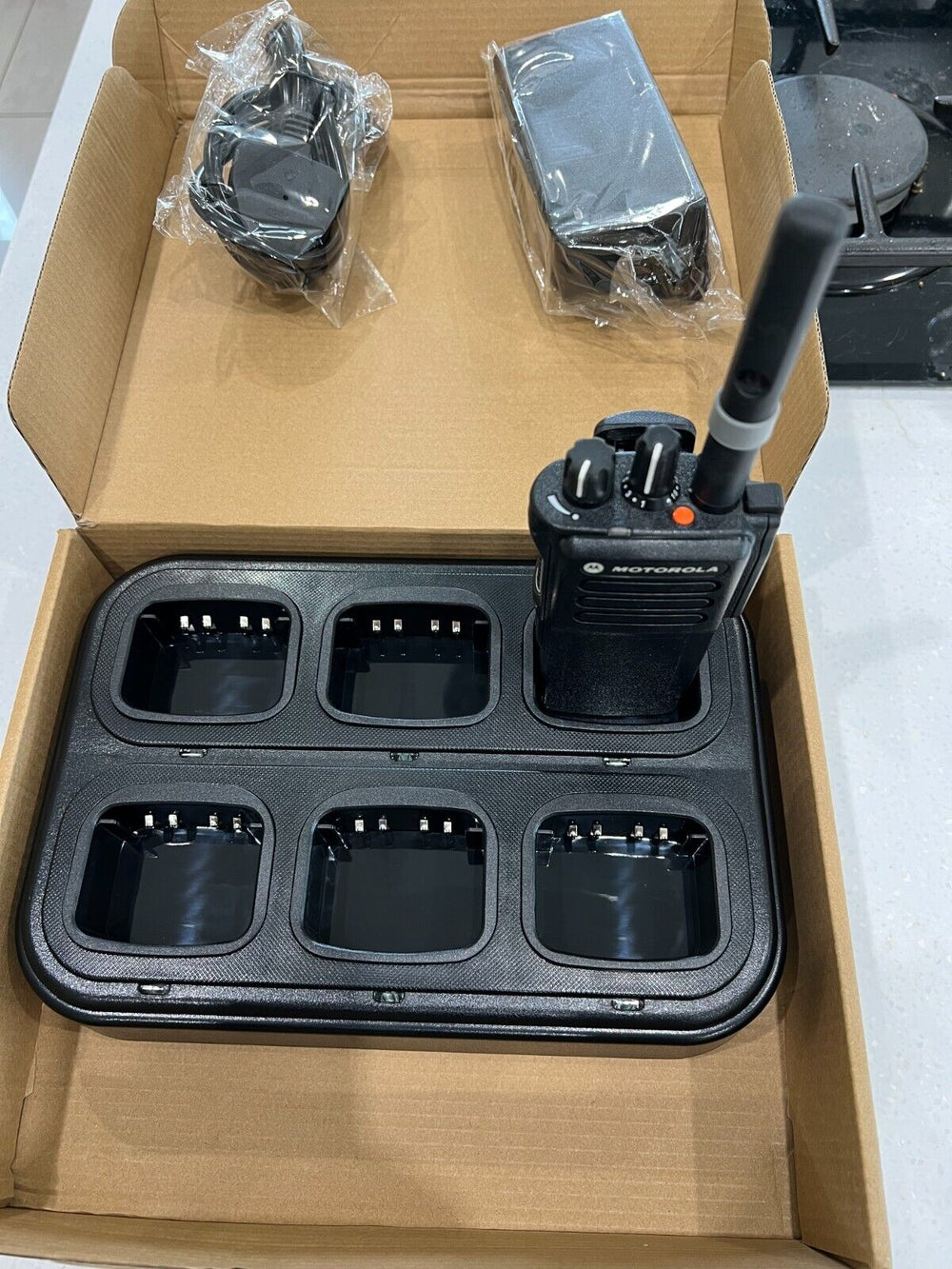 Motorola 6-way rapid charger UK for two-way radios with six charging slots and included accessories