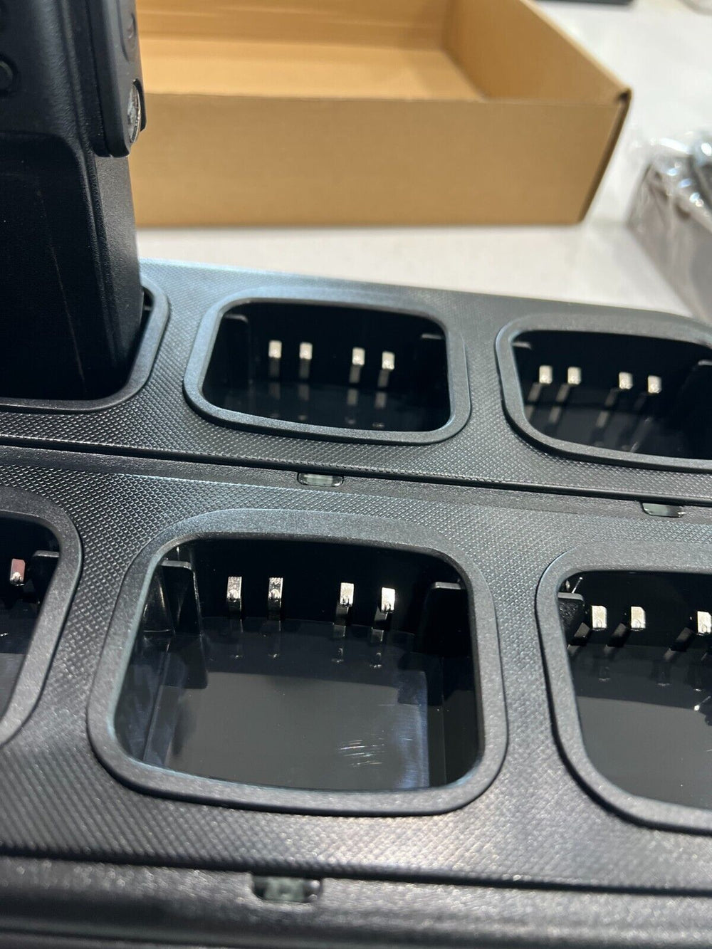 Motorola 6-way rapid charger UK with multiple charging slots for efficient battery management